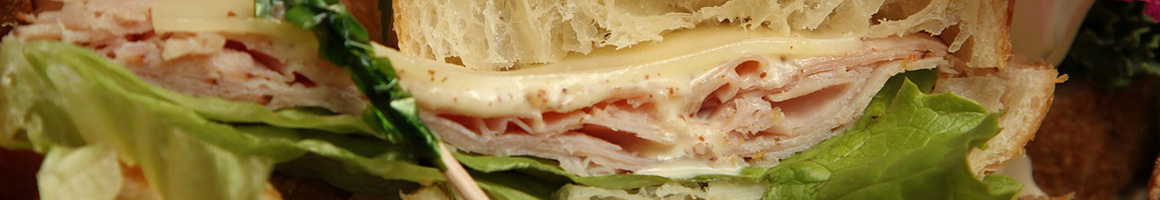 Eating Sandwich Puerto Rican Bakery at Taino's Bakery & Deli restaurant in Orlando, FL.